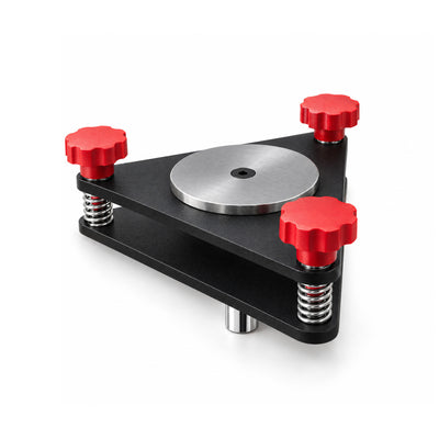AutoSolo Runout Compensation Adapter, angled view with two matte black steel plates, three red knobs, the steel center disc and the chrome plug