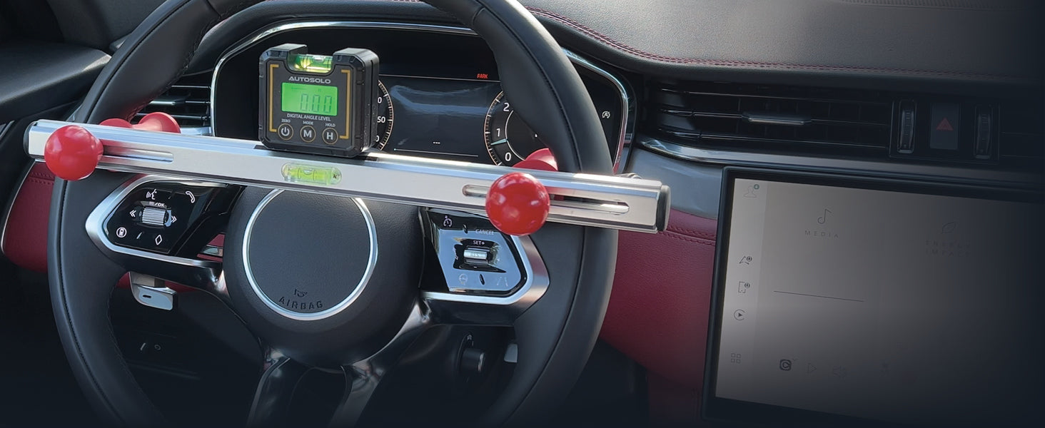 ASSTL1 level with the ASMDL360 digital angle level on its magnetic top, mounted on a steering wheel