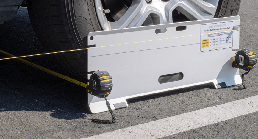 ASTPSETX kickout plates against tire sidewalls with vehicle on the ground