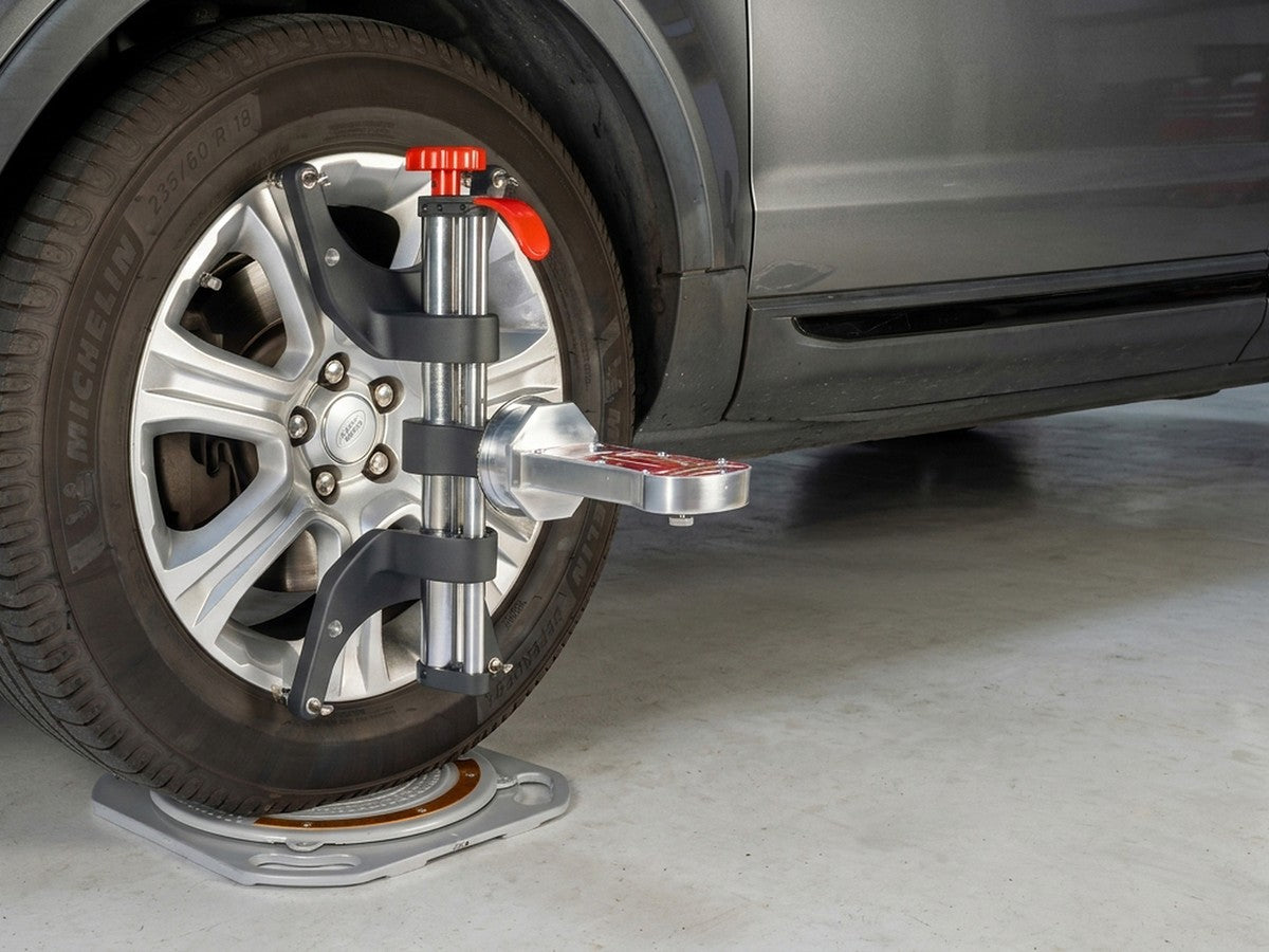 AutoSolo ASCCKG camber caster and KPI gauge magnet-mounted to the ONYX PRO wheel clamp on a front wheel