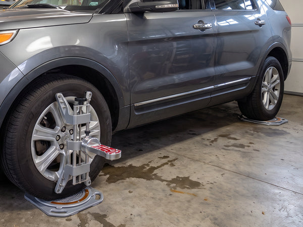 AutoSolo ASCCKG camber caster and KPI gauge magnet-mounted to the wheel clamp face